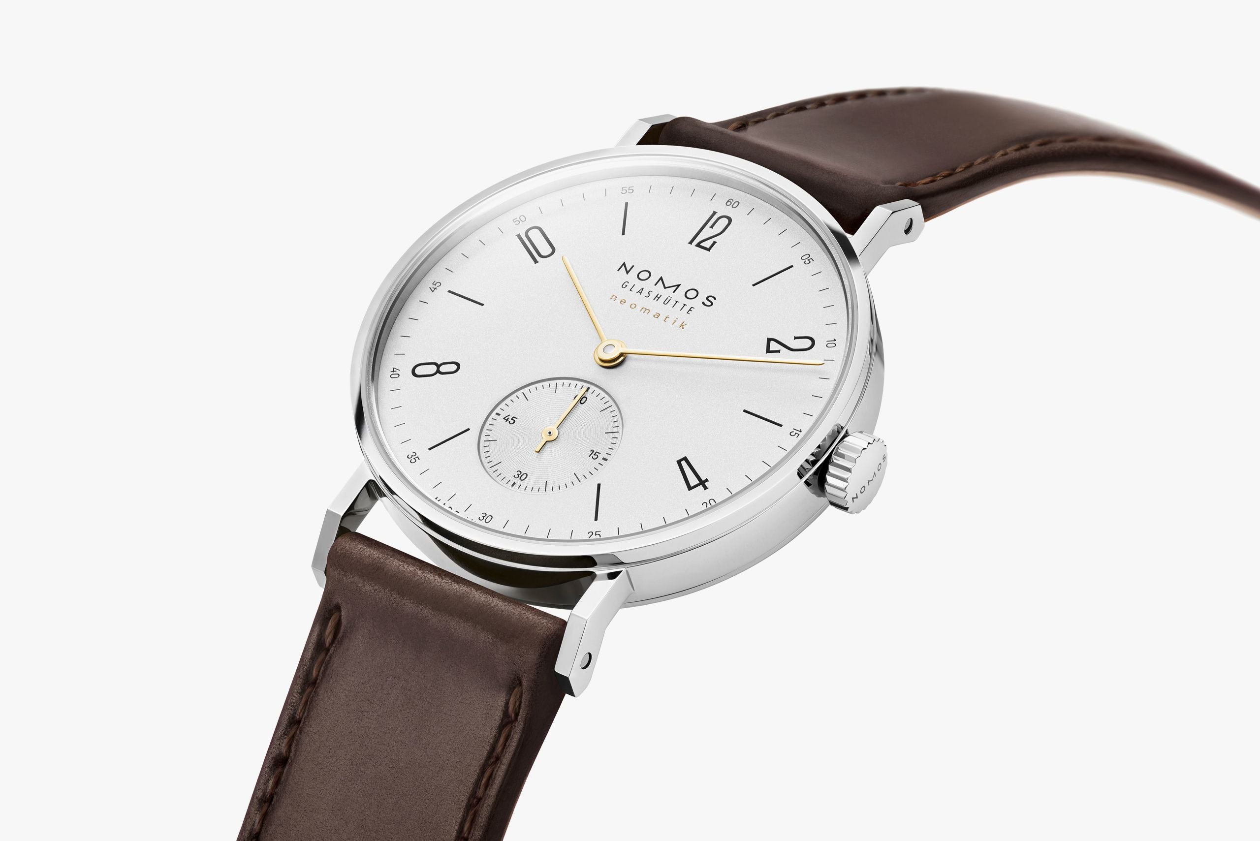 Watch with a brown leather strap and white dial on a white background