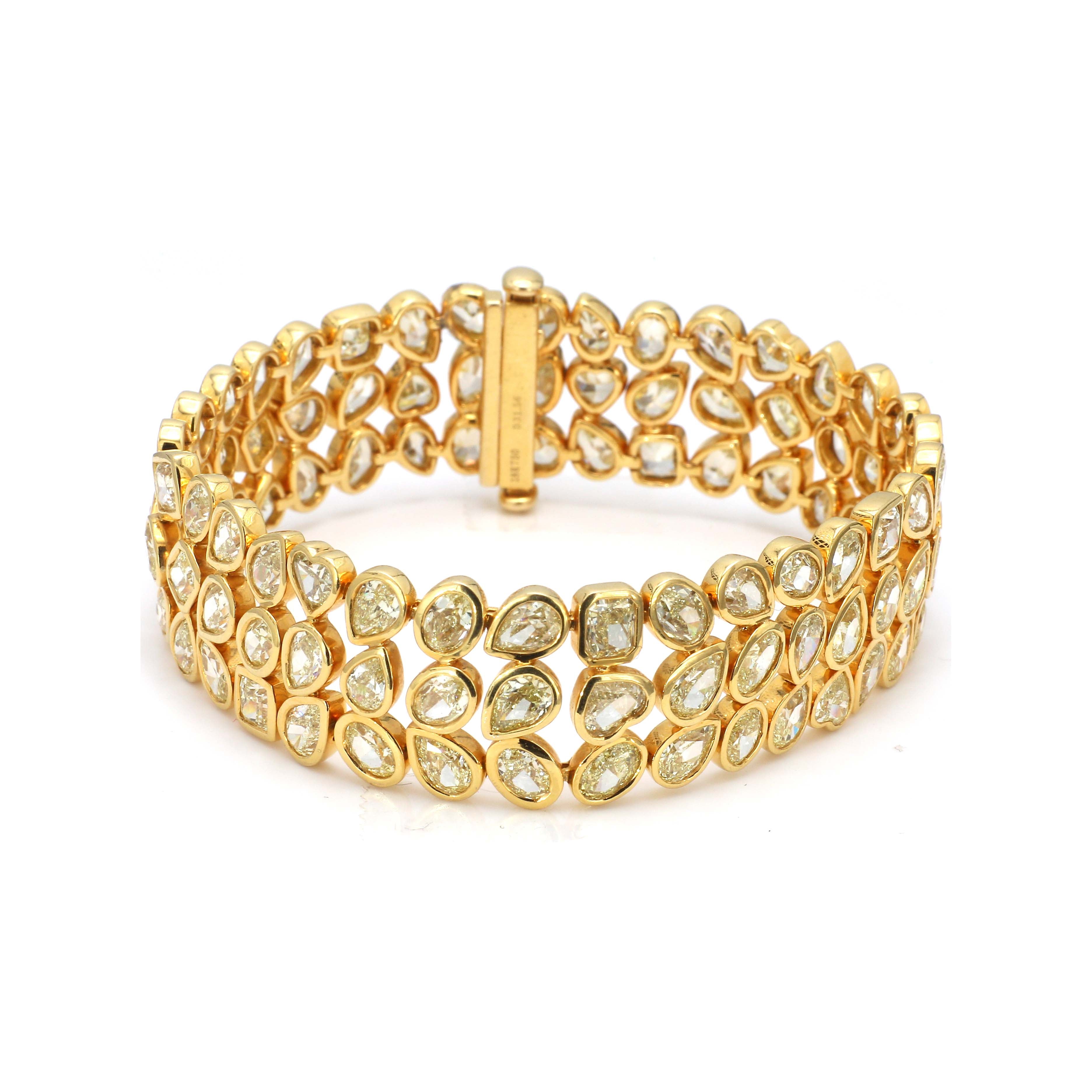 Yellow gold diamond bracelet on white background