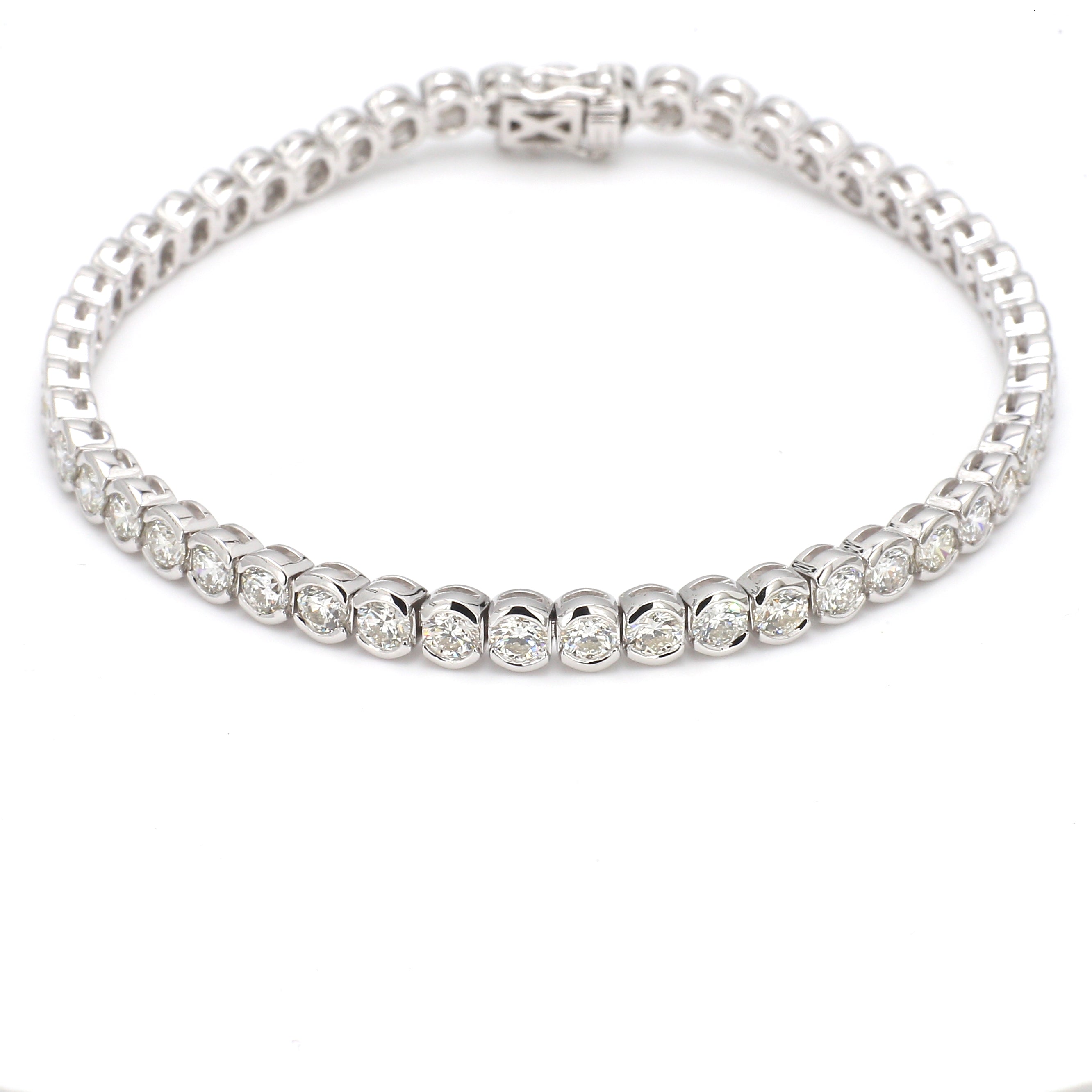 White gold diamond tennis bracelet on white background