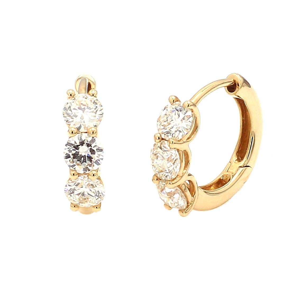 Gold hoop earrings with diamonds on white background