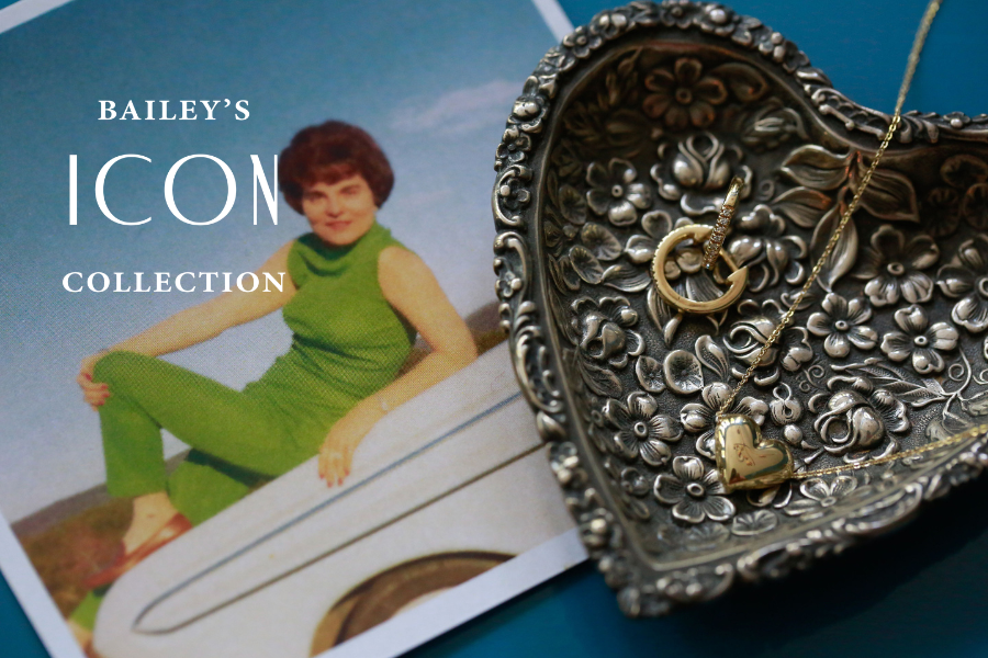 Decorative silver belt buckle with intricate designs on a magazine cover featuring a woman in a green dress.