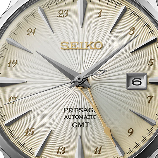 Seiko Presage watch face with gold and silver accents