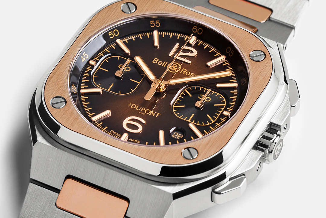 Luxury watch with rose gold and silver band on a white background
