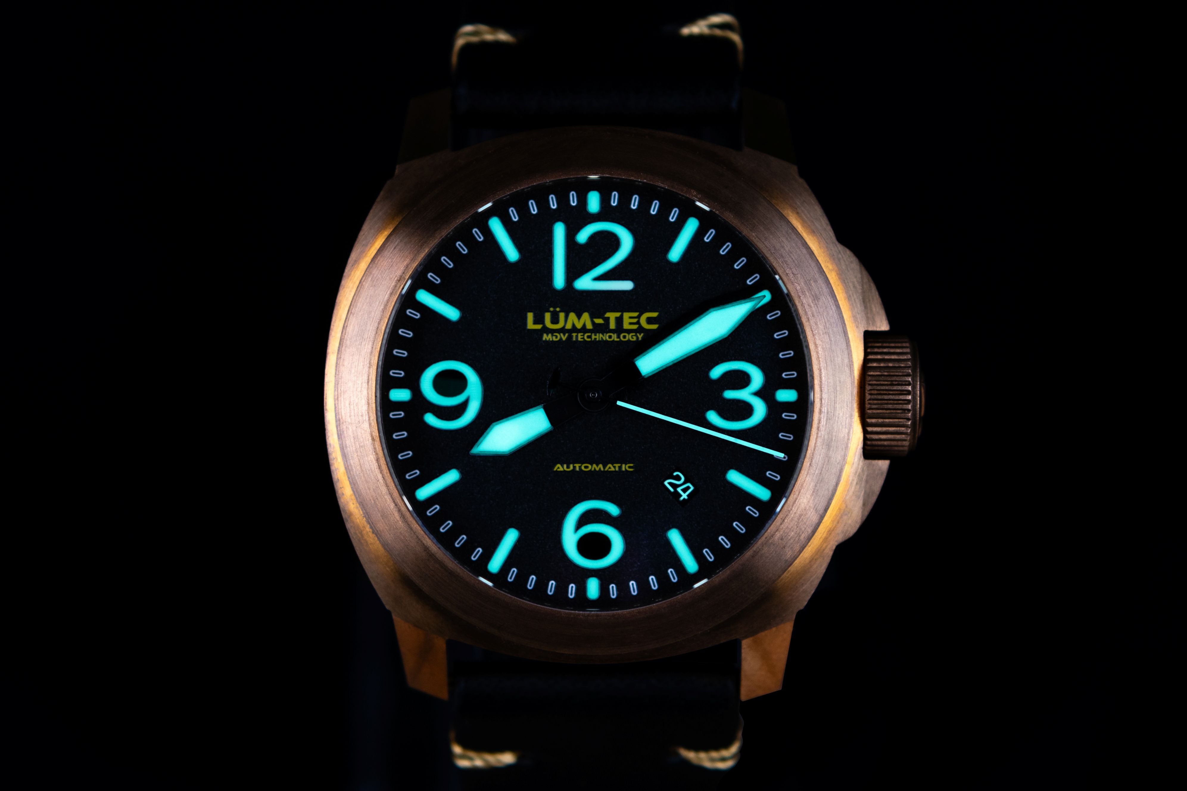 Lum-Tec watch with glowing blue numbers on a black background