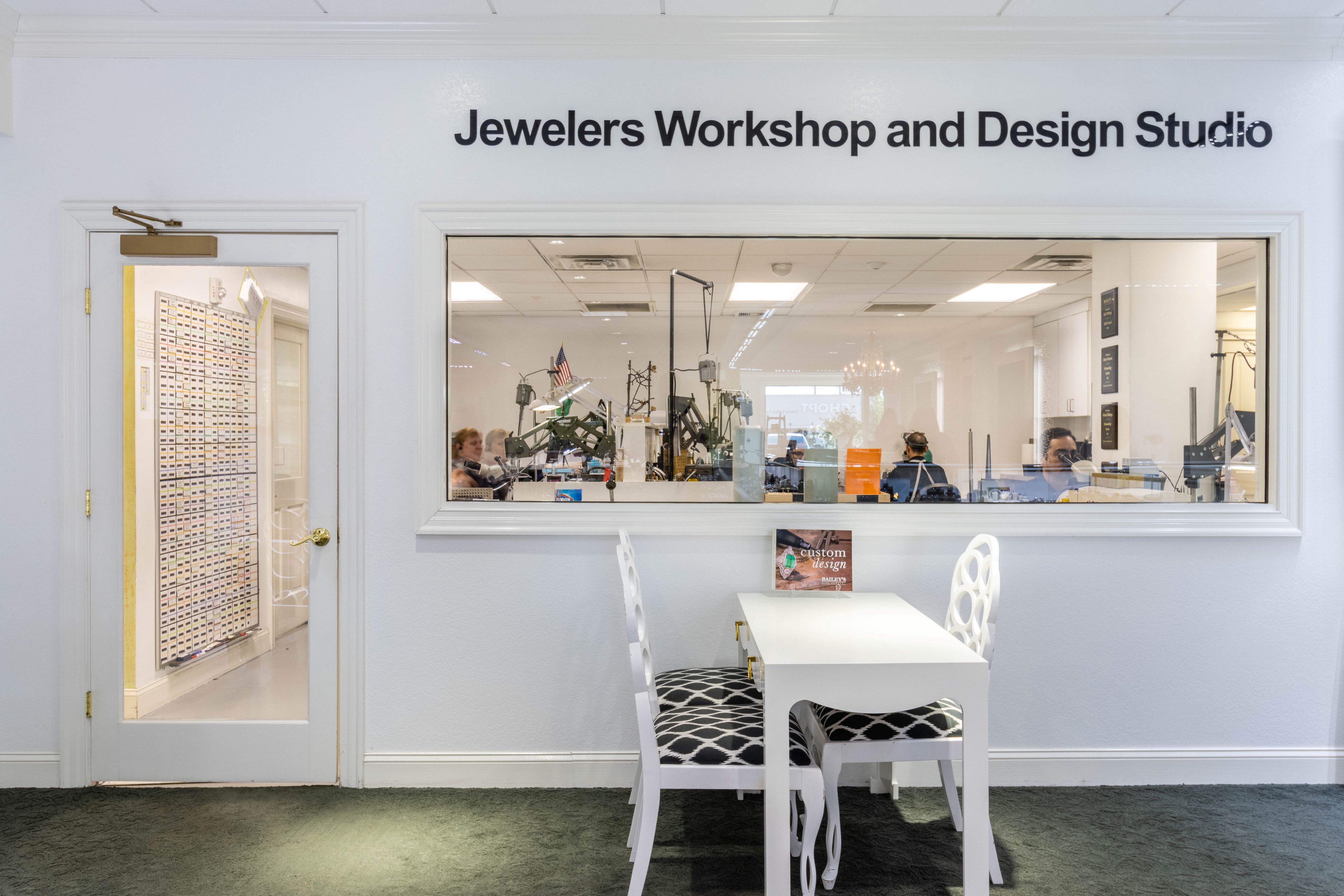 Jewelers Workshop and Design Studio with a glass window showing interior activities.