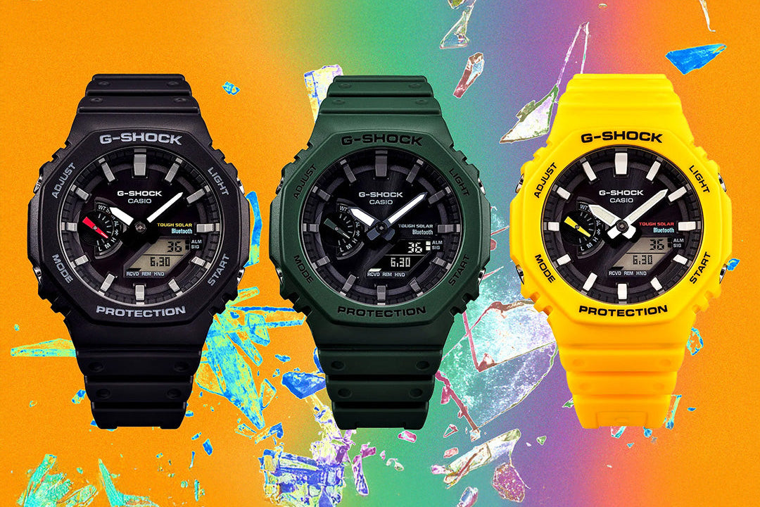 Three G-Shock watches in black, green, and yellow on a colorful background