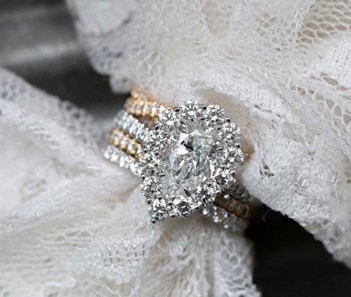 Diamond ring on a lace fabric background