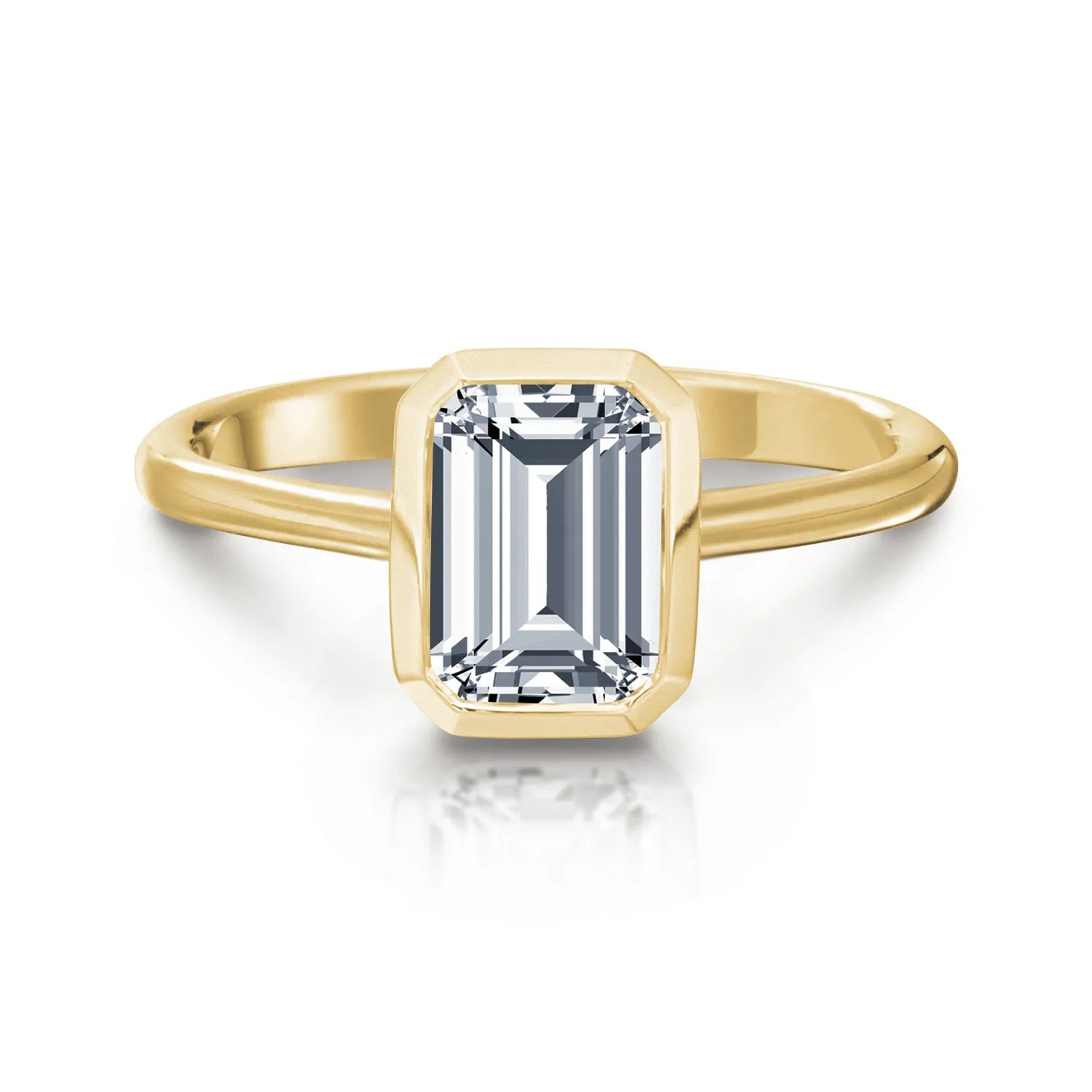 Gold ring with an emerald-cut diamond on a white background
