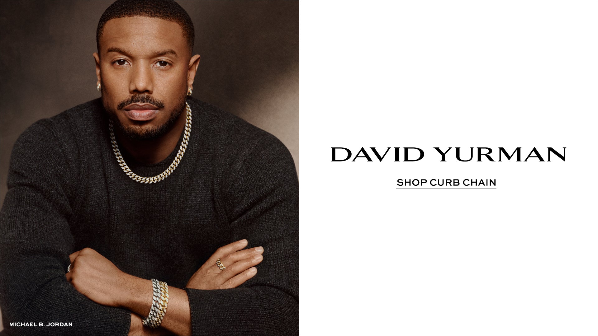 Man wearing jewelry with David Yurman branding on a white background