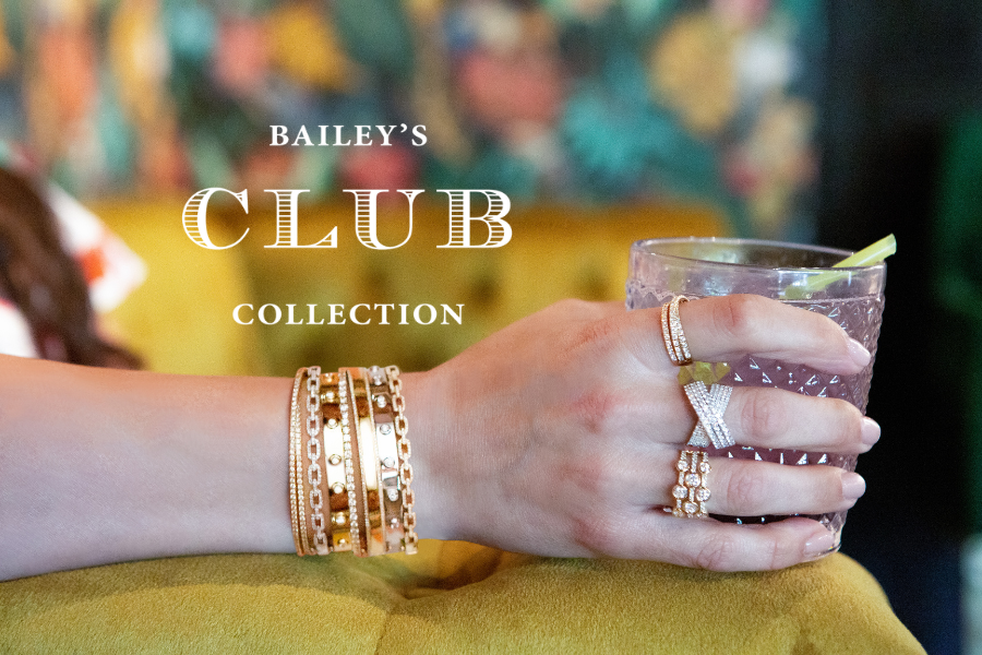 Hand holding a cocktail with 'Bailey's Club Collection' text in the background