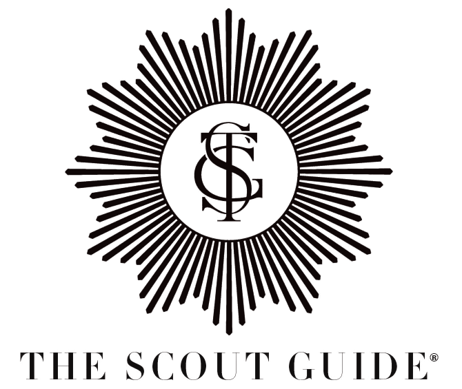 Logo of The Scout Guide with sunburst design and monogram on a white background
