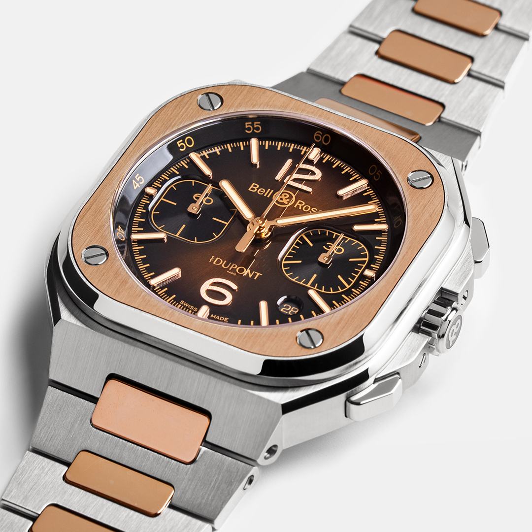 Luxury watch with rose gold and silver band on a white background