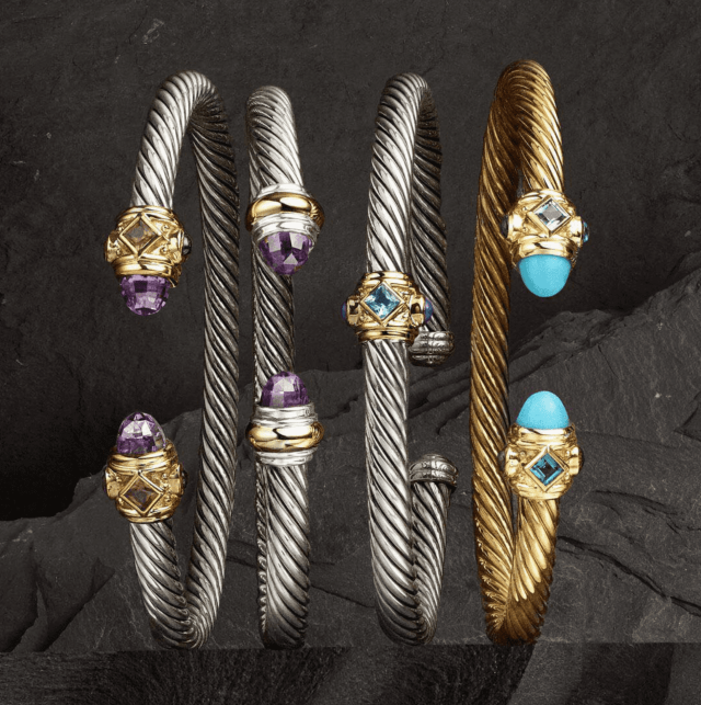 Set of bracelets with gemstone accents on a dark textured background