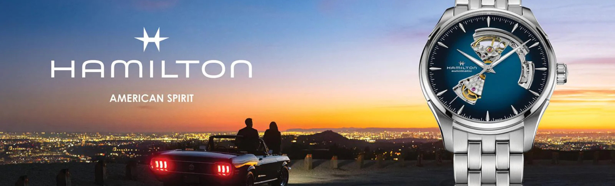 Hamilton watch with a scenic background of a sunset over a city.