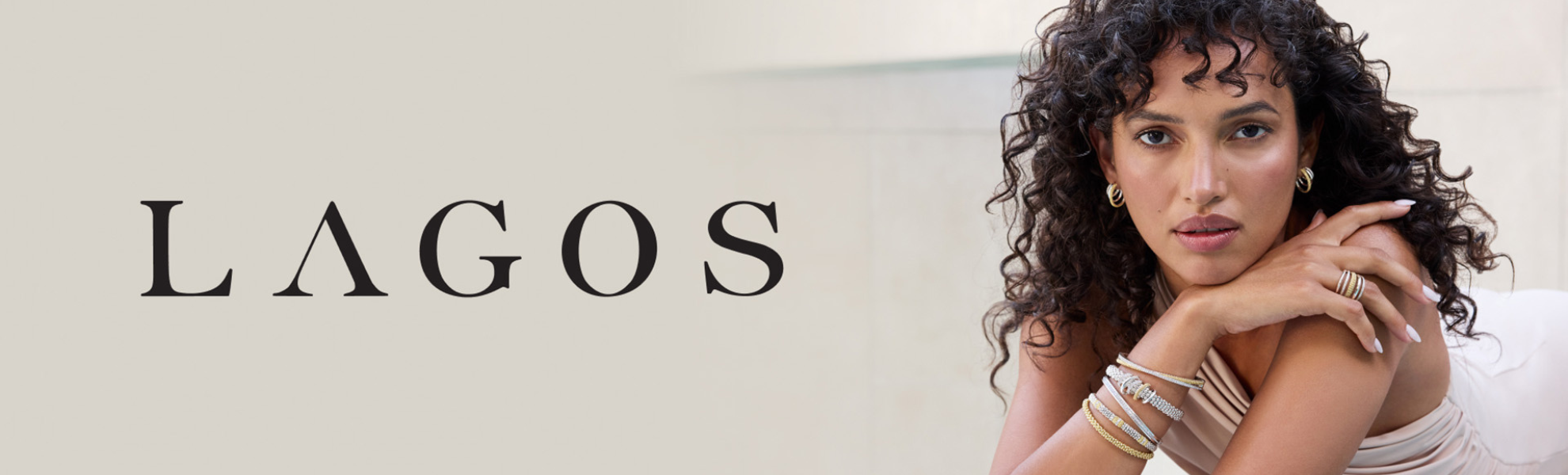 Woman with curly hair and jewelry, with 'LAGOS' brand name displayed.