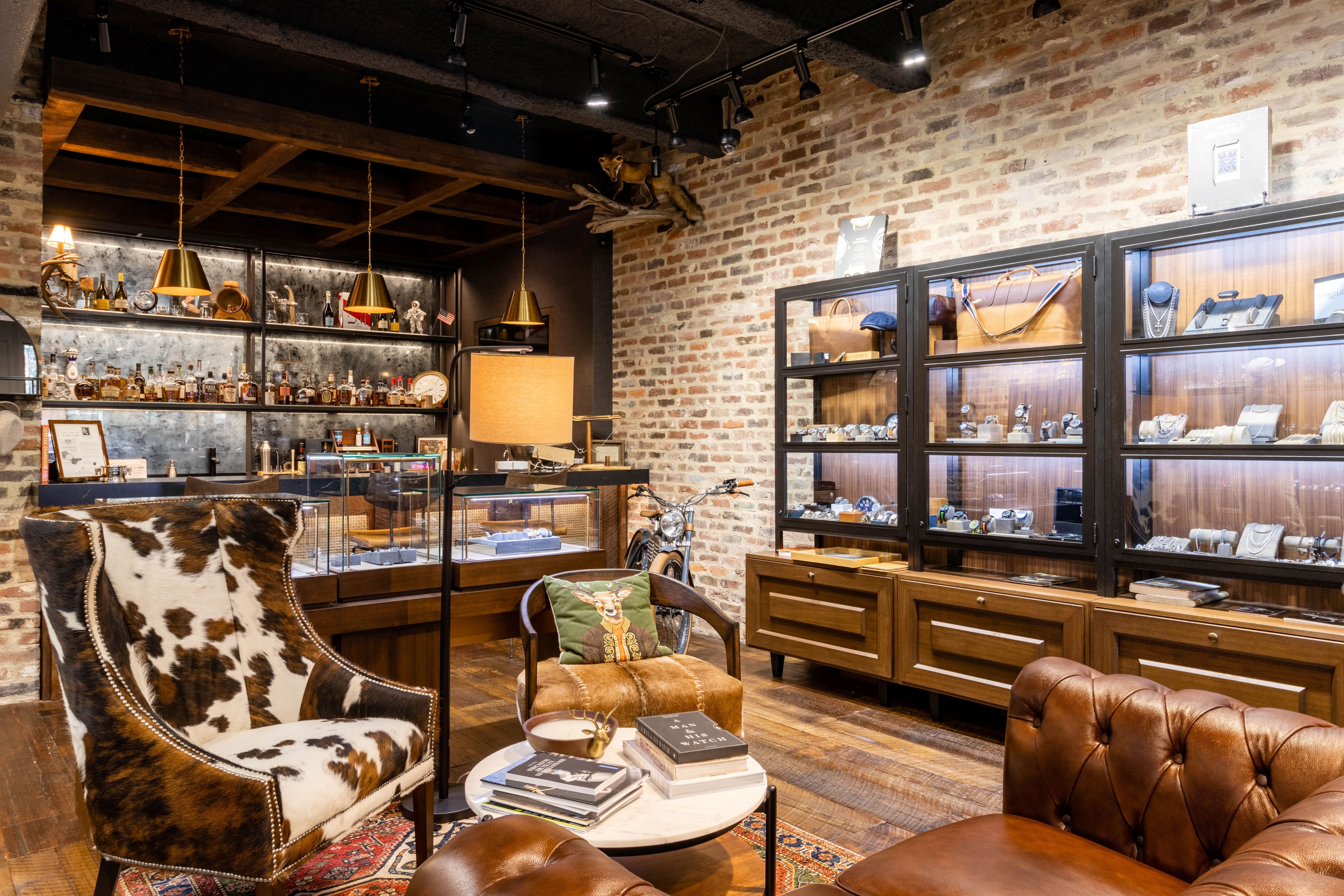 Luxury interior with leather furniture and decorative items in a high-end store setting.