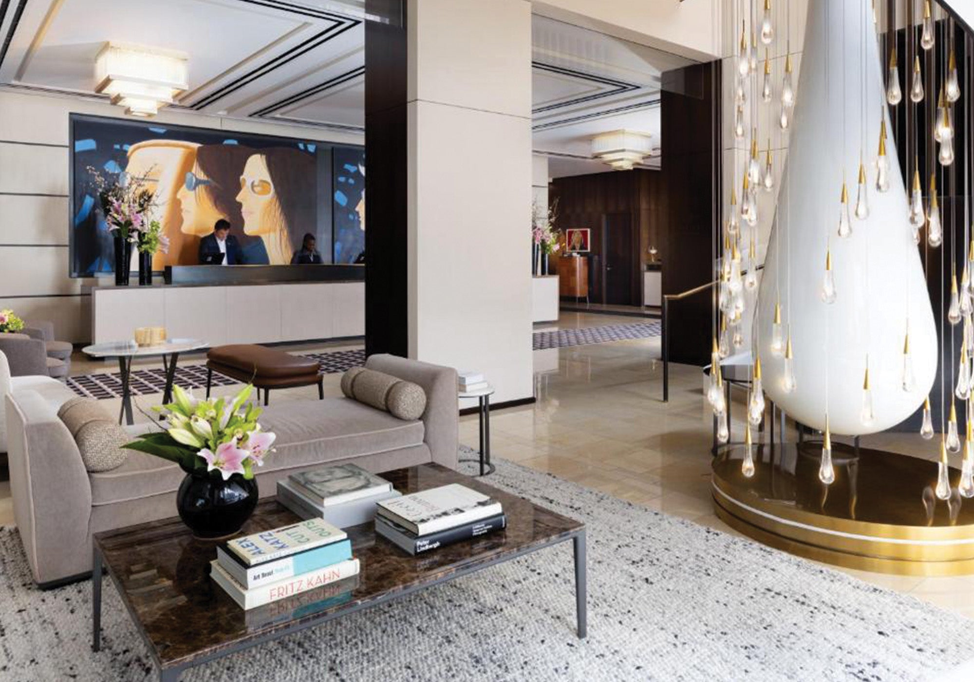 Modern living room with a large TV, sofa, and decorative elements.