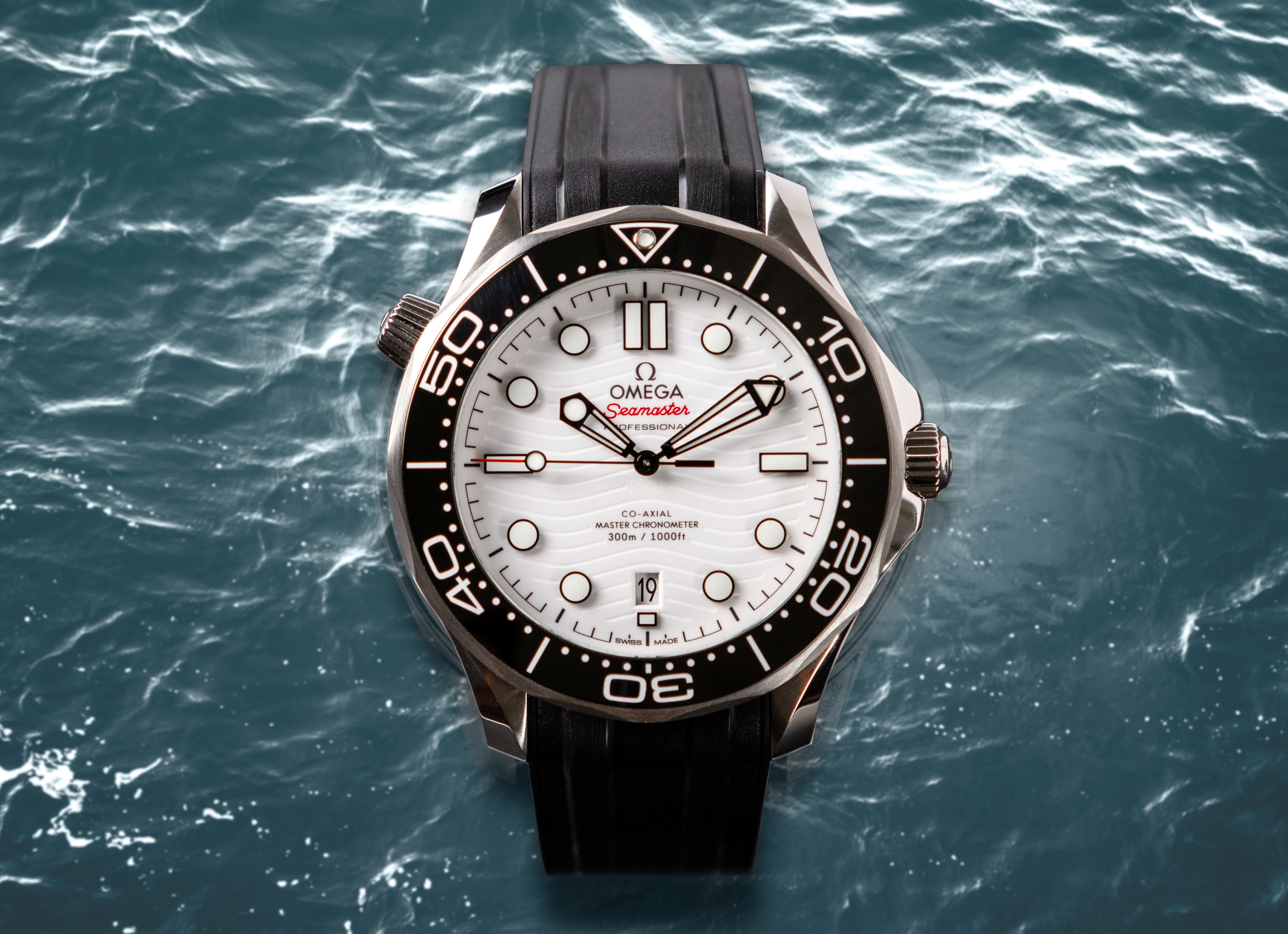 Omega watch with black strap on a water background