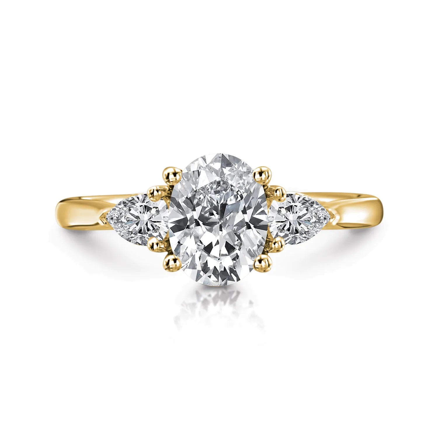 Gold ring with a central diamond and two smaller diamonds on a white background
