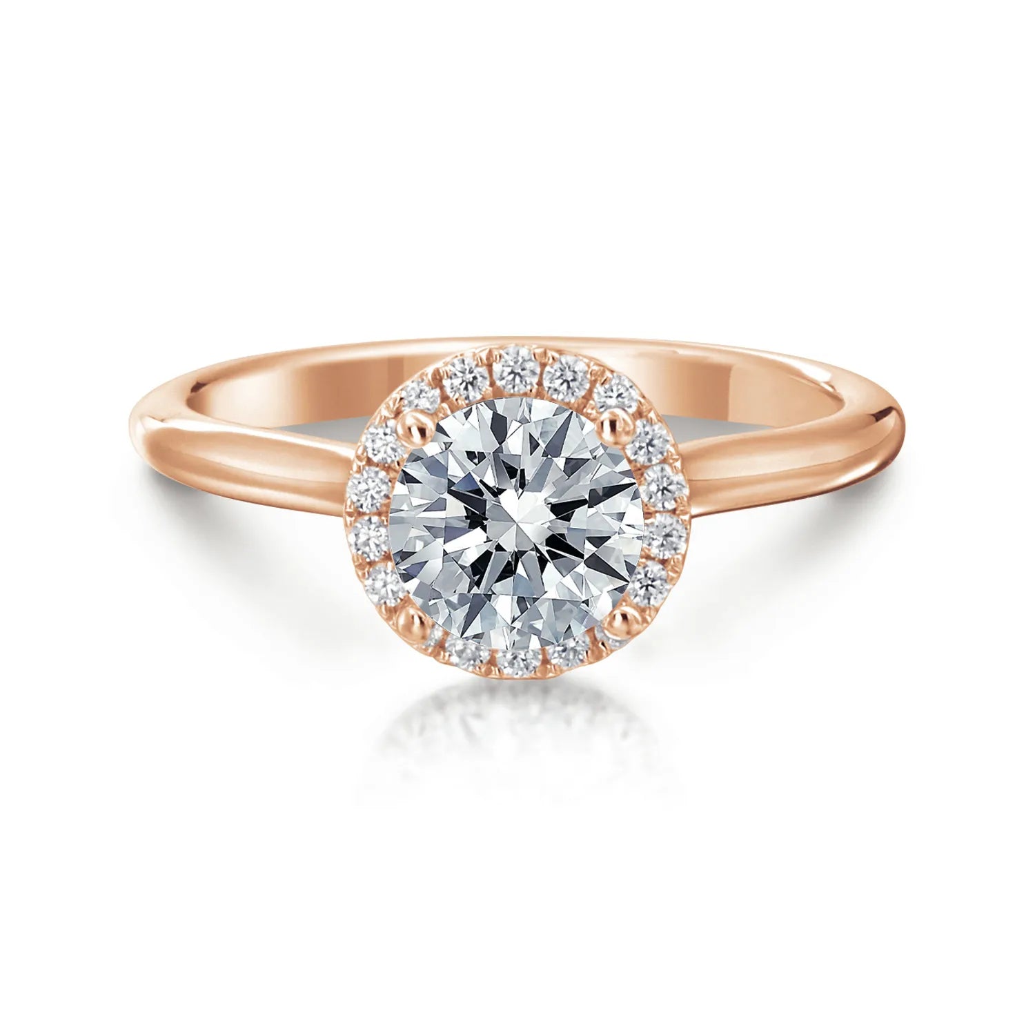 Rose gold ring with a large diamond and smaller diamonds around on a white background